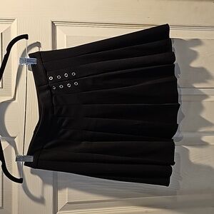 Black pleated skirt with lace up detail